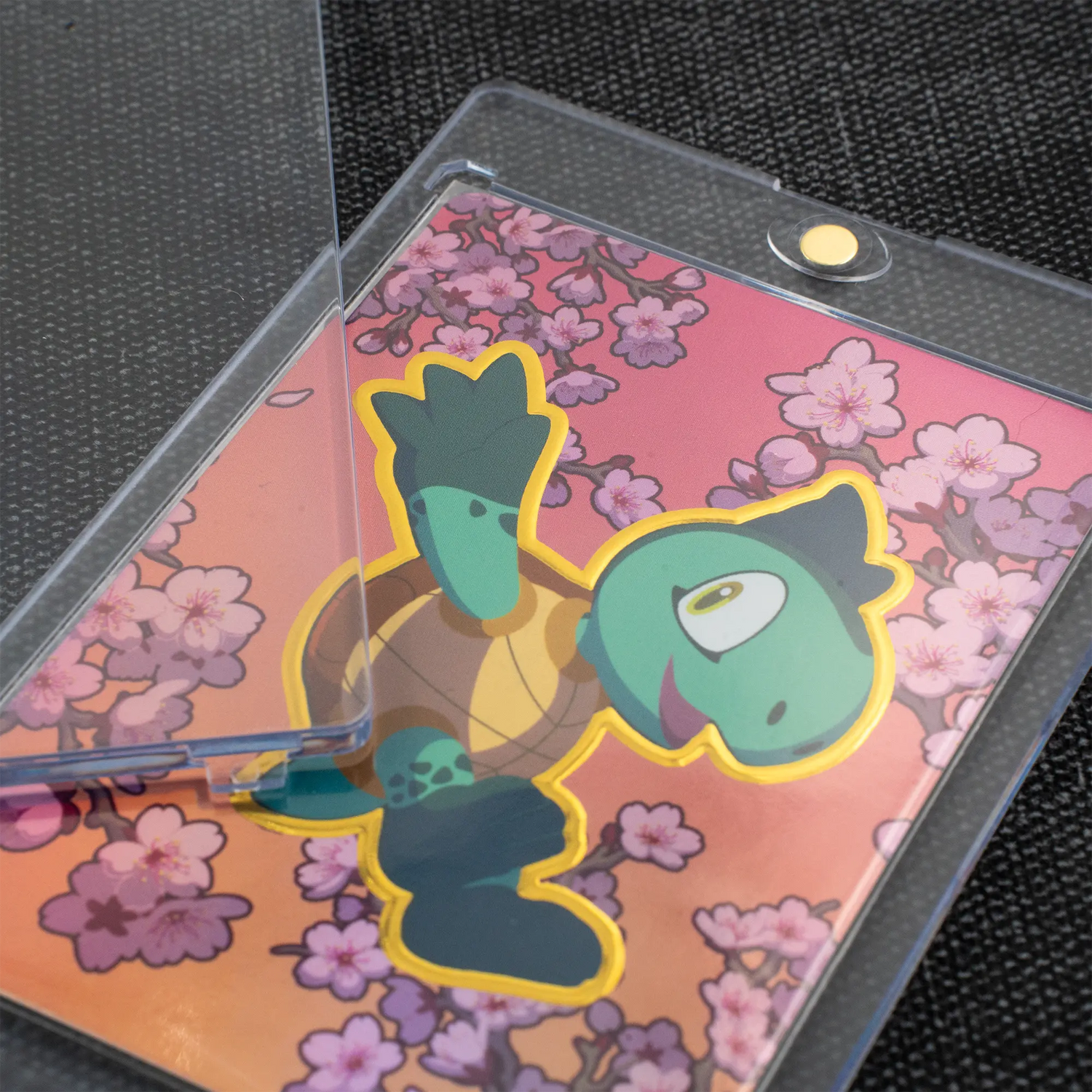 zoomed view of open clear magnetic card holder with 35pt thickness for tcg trading cards