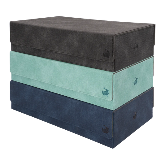 stack of black, turquoise and night blue caratex boxbay 1000+ mass storage boxes with removable, magnetic cover for tcg trading card game deck boxes and accessories