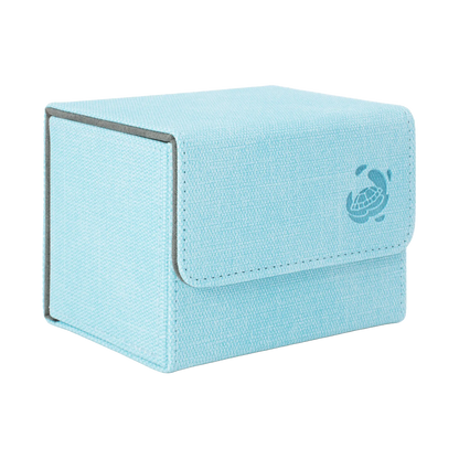 closed light blue resistant denim-like cardcove 100+ deck box with magnetic cover and extra-wide interior for outer sleeves that fits up to 100 double-sleeved or 120 single-sleeved standard or japanese size tcg trading cards