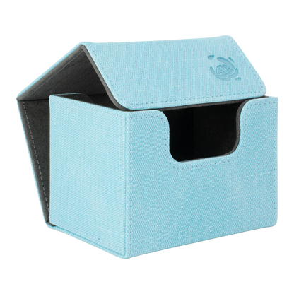 open light blue resistant denim-like caratex cardcove 100+ deck box with magnetic cover and extra-wide interior for outer sleeves that fits up to 100 double-sleeved or 120 single-sleeved standard or japanese size tcg trading cards