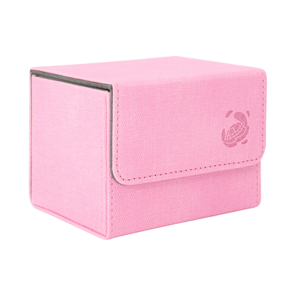 closed pastel pink resistant denim-like caratex cardcove 100+ deck box with magnetic cover and extra-wide interior for outer sleeves that fits up to 100 double-sleeved or 120 single-sleeved standard or japanese size tcg trading cards