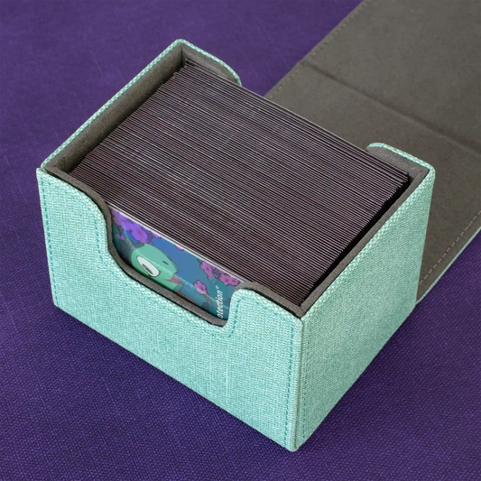 detail view of opened turquoise caratex cardcove deck box filled with up to 100 double-sleeved tcg cards