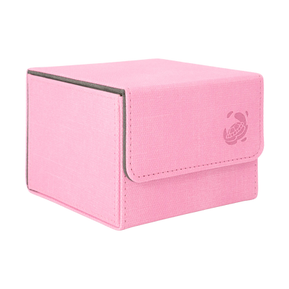 closed pastel pink resistant denim-like caratex cardcove 133+ deck box with magnetic cover and extra-wide interior for outer sleeves that fits up to 133 double-sleeved or 160 single-sleeved standard or japanese size tcg trading cards