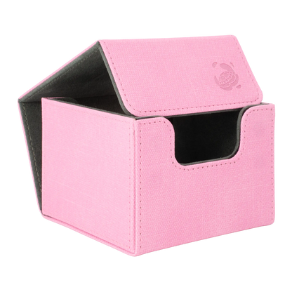 open pastel pink resistant denim-like caratex cardcove 133+ deck box with magnetic cover and extra-wide interior for outer sleeves that fits up to 133 double-sleeved or 160 single-sleeved standard or japanese size tcg trading cards