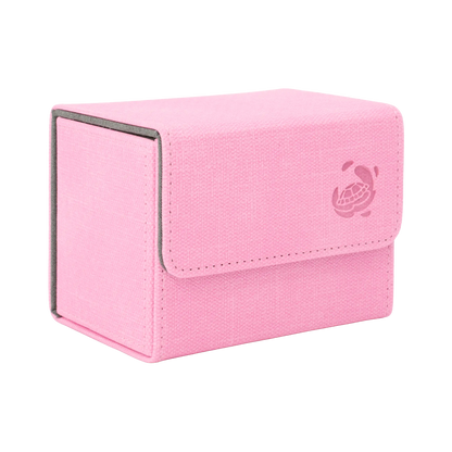 closed pastel pink resistant denim-like caratex cardcove 80+ deck box with magnetic cover and extra-wide interior for outer sleeves that fits up to 80 double-sleeved or 100 single-sleeved standard or japanese size tcg trading cards