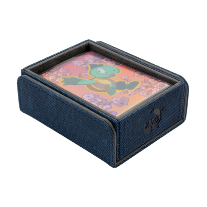 open night blue resistant denim-like caratex tokencove box for dice, tokens and counters or sleeved tcg trading cards filled with cards and with removable, magnetic cover clipped to bottom