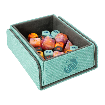 open turquoise resistant denim-like caratex tokencove box for dice, tokens and counters or sleeved tcg trading cards filled with various dice and with removable, magnetic cover clipped to bottom