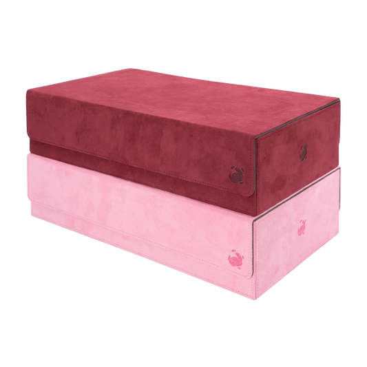stack of wine red and pastel pink soft resiplush boxbay 1000+ mass storage boxes with removable, magnetic cover for tcg trading card game deck boxes and accessories