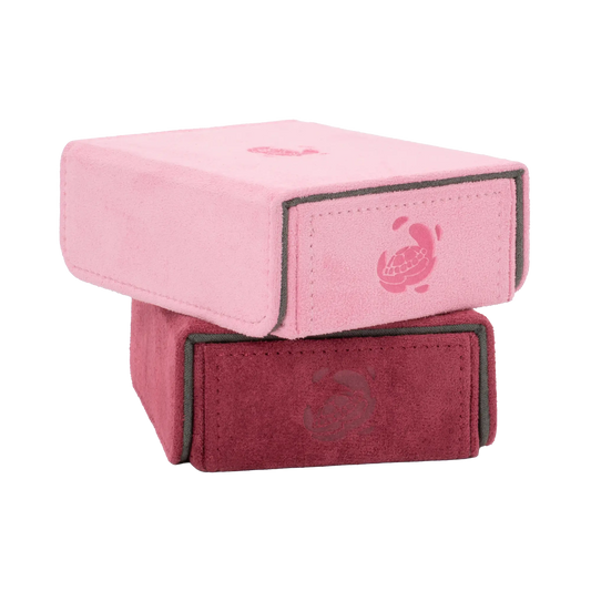 stack of pastel pink and wine red soft resiplush tokencove boxes with removable, magnetic cover for dice, tokens and counters or sleeves tcg trading cards