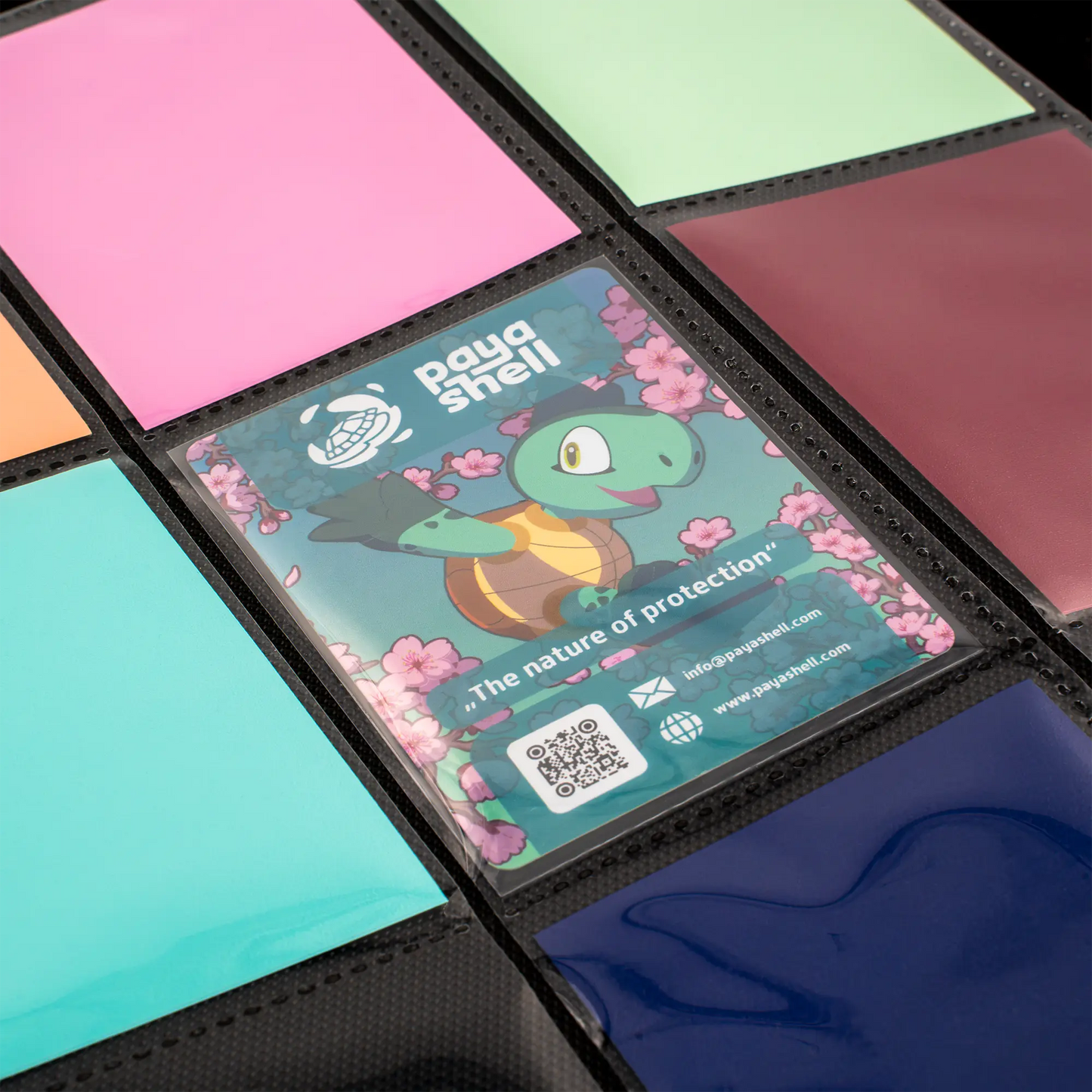 zoomed in inside view of cards in resiplush zip-up album binder for standard and japanese size tcg trading cards with sideloading pockets, 20 double-sided, black pages and 3 extra mesh pockets for toploader card shields or magnetic card holders