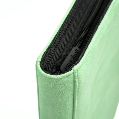 zipper view of pastel green resiplush zip-up album binder for standard and japanese size tcg trading cards with sideloading pockets, 20 double-sided, black pages and 3 extra mesh pockets for toploader card shields or magnetic card holders
